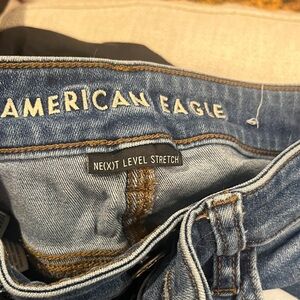 American Eagle Blue Jeans with Brown Patch